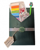A prewrapped mystery book tied with a ribbon and a small clue tag